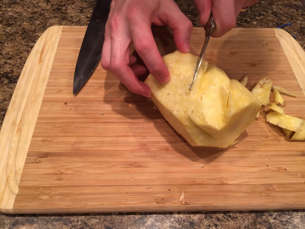 Cut pineapple diagonally