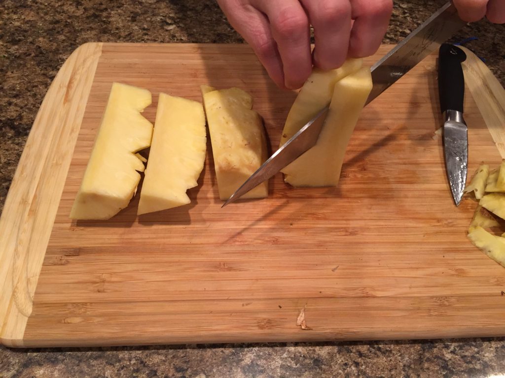 Cut off pineapple core