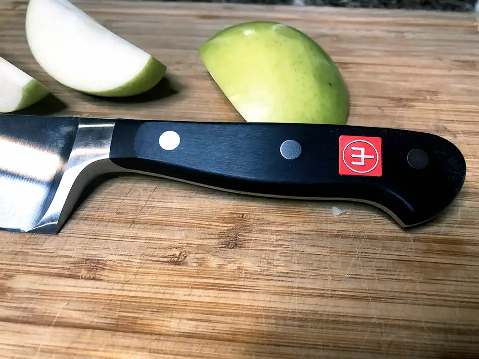 https://steelbluekitchen.com/wp-content/uploads/2021/10/Wusthof-Chef-Knife-Handle-Apple.webp